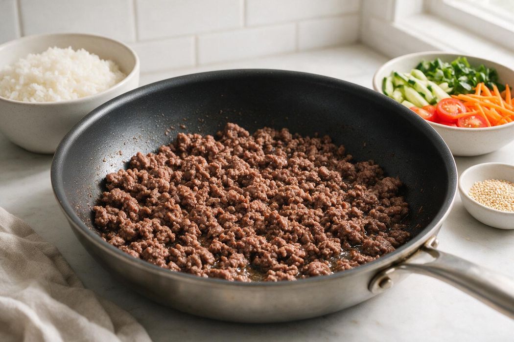 Korean-Style Ground Beef Rice Bowls step 1: Cook beef in a large skillet over medium-high heat 5–6 minutes, breaking it up, until browned and no longer pink (160°F/71°C). Drain excess fat